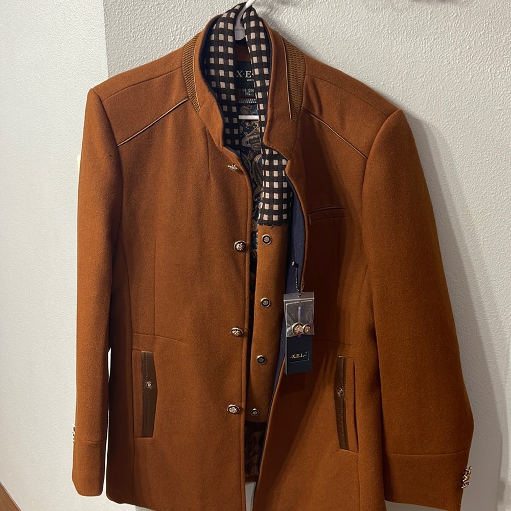 Brand new X.E.L. winter coat with zip out scarf accessory. Never been worn.